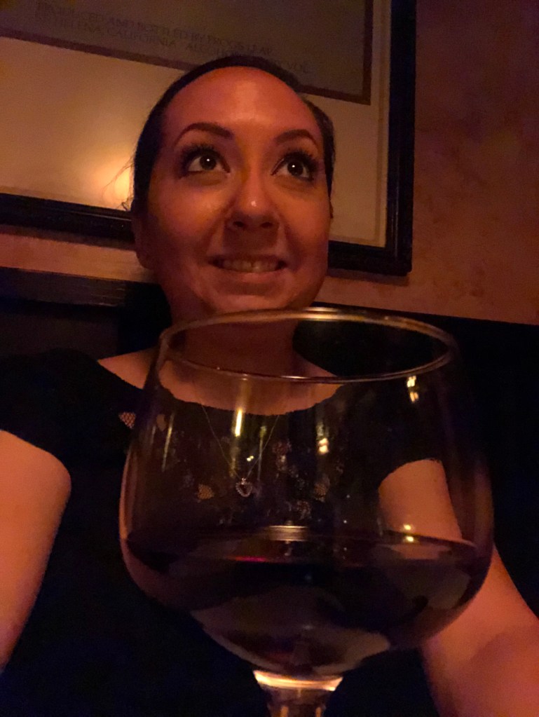 Katdom and a glass of wine